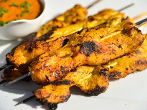 Skewers of Asian Chicken Satay with the side dishes