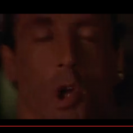 This image is a screenshot of Sylvester Stallone in Demolition Man. He is giving the ubiquitous 'O' face.