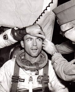 John Young sitting and being examined