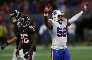 #52 of the Buffalo Bills with arms raised. His game play has caused overreactions