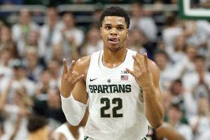 Spartan player holding three fingers up on each hand