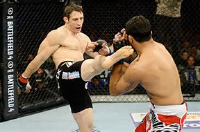 Tim Kennedy kicking someone in the head